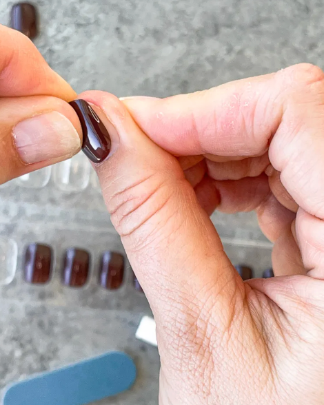 applying press-on nails